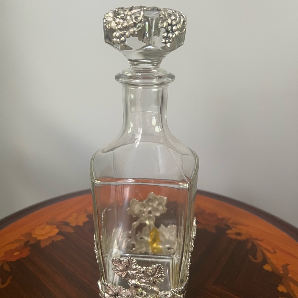 Crystal Decanter with silver embellishment, 10” Tall
Never used